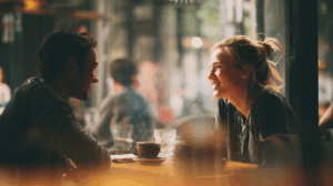Two coworkers having a casual conversation at a coffee shop
