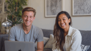 Two young adults professionals in a casual home study area.