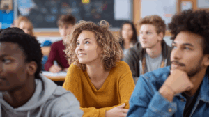 A group of diverse students sitting in a classroom, actively participating in a lesson