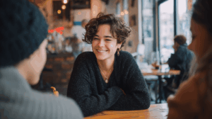 A person chatting with friends at a coffee shop