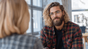 A person confidently discussing their future plans with a friend