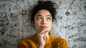 A person reflecting on their plans for the future, with a thoughtful expression. 