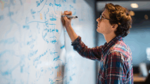 A person standing at a whiteboard