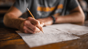 A student practicing their grammar, writing sentences