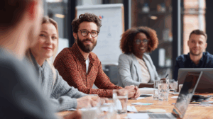 A team gathered in a meeting room, discussing the company’s growth.