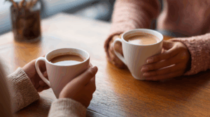 Two friends chatting over coffee