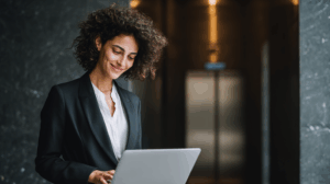 a young woman professional working using a laptop