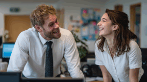 Two colleagues in an office role-play scenario. 