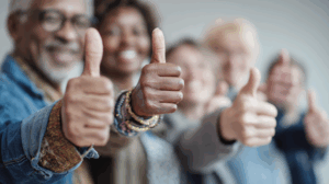 a group of people affirming (thumbs up or nods)