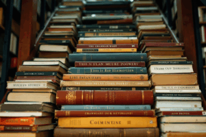 An upward staircase made of books titled with grammar topics