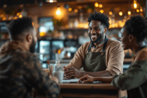 A smiling business owner talking to diverse customers through a screen