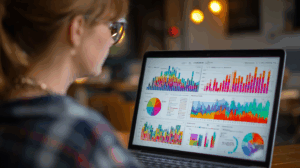 A marketing analyst looking at a colorful infographic on a laptop