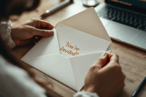 A person receiving an invitation through the mail or email