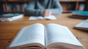 A student at a desk with an English grammar book open